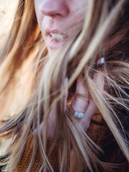 Woman’s face showing an expression as if she is about to speak.