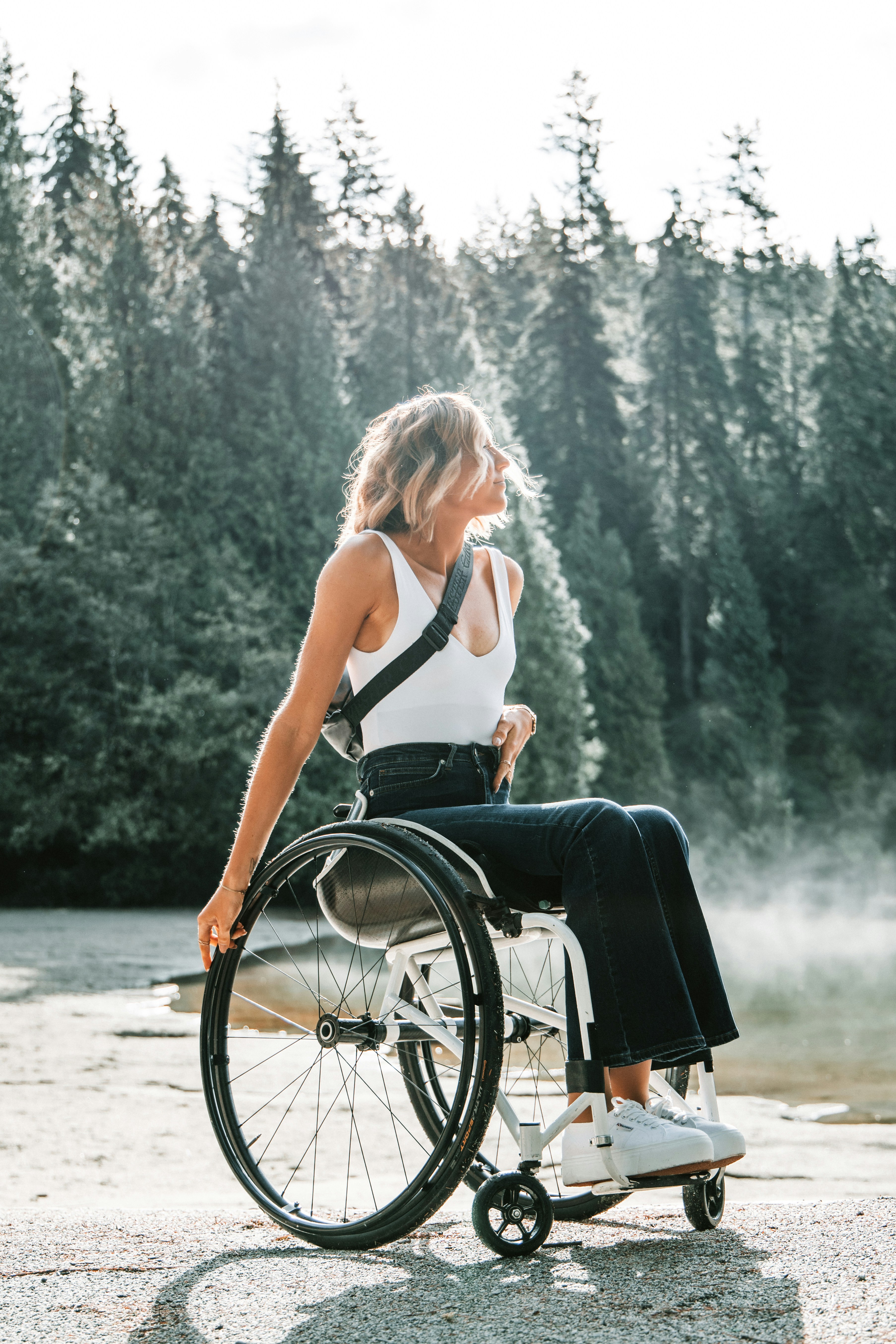 Woman in wheelchair with forest background